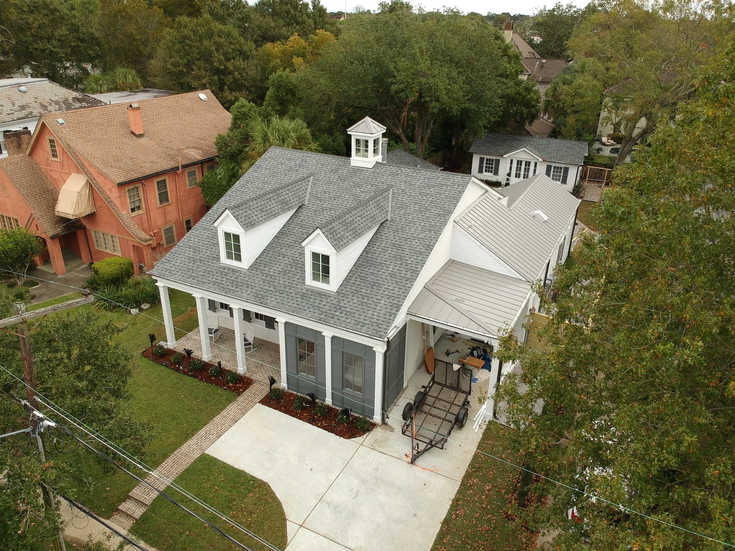 Aerial view of a home with a new shingle roof